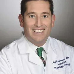 Portrait of Dr. Noah Federman in white coat 